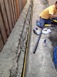 irrigation contractor in Delray Beach lays PVC pipe for a new installation